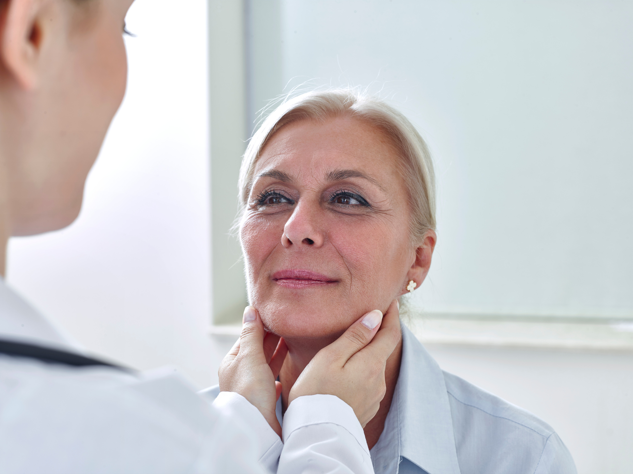 Woman is being examined for lymph node swelling. Clinicians at Grace Health Urgent Care Center in Raeford complete these types of examinations in evaluating acute illness. 